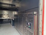 an image of a commercial kitchen with stainless steel appliances
