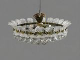 a glass chandelier hanging from the ceiling