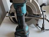 a corded circular saw on a table next to a corded circular saw