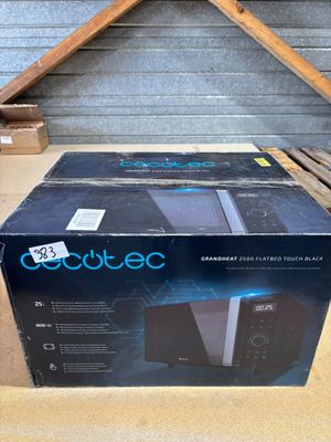 an open box of a microwave oven sitting on top of a table