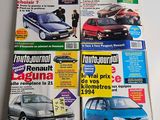 four magazines of different cars on a white surface