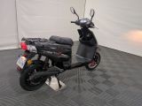 a scooter that is parked in a garage