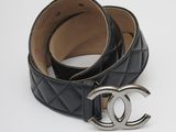 a close up of a black belt with a silver buckle