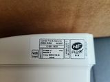 a close up of a white electronic device on a table