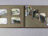 an open book with pictures of people and animals on it