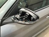 a close up of a car door handle with wires in it