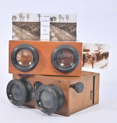 a wooden box with two cameras on top of it