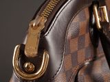 a close up of a purse with a zipper on it