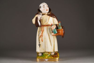 figurine of a monk holding a basket and a bottle