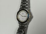 a close up of a wrist watch on a white surface