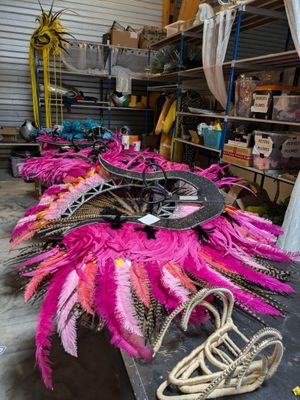 a table with a bunch of pink feathers on it