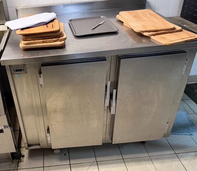 a kitchen with a stainless steel counter top and a metal oven