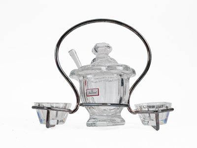 a glass teapot and two cups on a stand