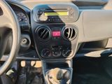 a dashboard of a small car with buttons and a steering wheel