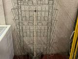 a metal rack that has a bunch of baskets on it