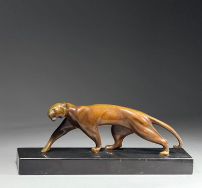 a bronze sculpture of a cat on a black base