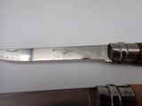 a knife on the table next to a knife on the table