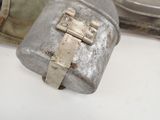 a metal container with a metal latch on top of it