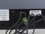a close up of a power supply on a white surface