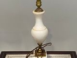 a lamp that is sitting on a table with a checkered table cloth
