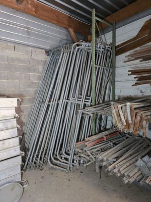 many pieces of wood stacked on top of each other in a room