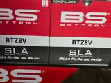 two boxes of batteries sitting on top of each other
