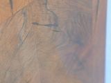 a close up of a wooden table with a clock on it