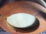 a clock that is sitting on top of a wooden table