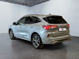 the rear end of a silver 2020 acura parked in a garage