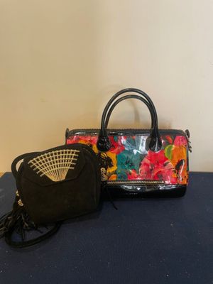 two handbags on a blue surface
