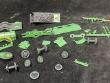 a lot of green toys on the ground