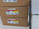three cardboard boxes stacked on top of each other on a white surface