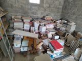a room full of books and a ladder in it