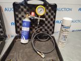 a case with a hose and a pressurer in it