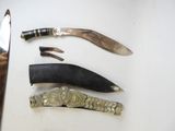 three different types of knives on a table