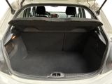the back of a car with its trunk open and the back seats folded down