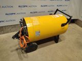 a large yellow tank sitting on top of a cement floor