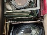 a cardboard box filled with assorted items in it