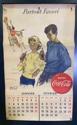 un calendrier vintage Coca-Cola accroché au mur
