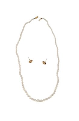 a close up of a necklace and earrings on a white background