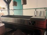 an image of a commercial kitchen with a lot of counter space