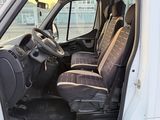 a white van with a black seat covers and a steering wheel