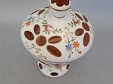 an image of a small ceramic pot with a heart on it