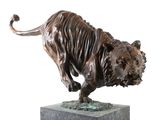 bronze statue of a bull on a marble base on a white background