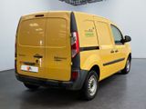 a yellow van that is parked in a room