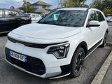 the white suv is parked in the parking lot next to other cars