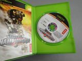 the xbox game is in a green case with the disc