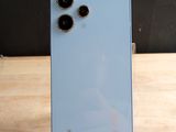 the back of a blue phone with two camera lenses on it
