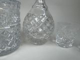 bottles and glasses on a table with a white background