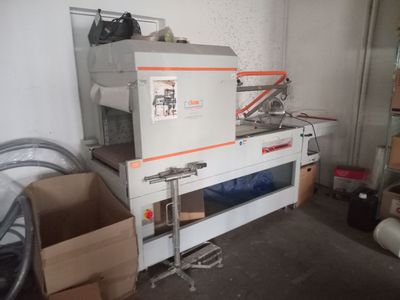 a machine that is sitting in a room next to boxes